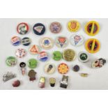 A collection of assorted vintage badges, some enamelled. To include: Watneys, Robertsons golly,