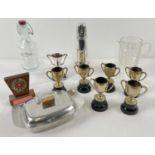 A box of assorted vintage items to include silver plated trophy cups, Viners sugar sifter, mid