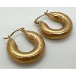 A pair of 9ct yellow gold hooped earrings with hinged posts. Posts stamped 375, outer diameter