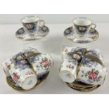 A set of 10 Aynsley coffee cups and saucers in a floral design, with blue and gilt detail.