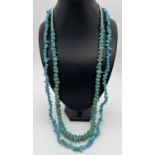 2 large turquoise beaded necklaces. A 34" necklace of large turquoise chips together with 30"