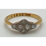An 18ct gold Art Deco diamond dress ring. Diamond shaped mount with pierced work to sides, set