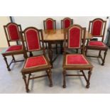 A vintage medium oak drop leaf table with shaped legs together with 6 dining chairs with red and