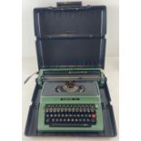 A vintage green Silver-Reed 500 typewriter complete with carry case.