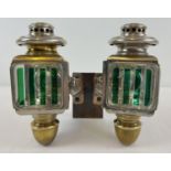 A pair of early 20th century French acetylene car lamps with green striped lenses. Mounted onto a