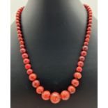 An 18" red jasper graduating beaded necklace with silver tone magnetic barrel clasp. Retired