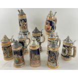 A collection of 10 assorted large vintage lidded ceramic steins, to include musical examples. In