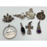 8 silver and white metal pendants/charms to include Noah's Ark, bird claw holding a faux pearl,