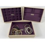 3 'Stackers' jewellery trays, in faux leather with purple baize interior, with a small selection