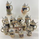 A collection of 15 assorted ceramic steins with hinged metal lids, to include musical examples. In