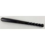 A vintage ebonised wooden truncheon. With shaped grip handle. Approx 38.5cm.