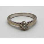 A 9ct white gold .20ct diamond solitaire ring. Full hallmarks to inside of band. Size Kï¿½, total