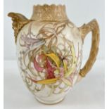 An antique Royal Doulton Burslem blush hand painted jug with floral decoration and gilt detail.