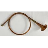 A vintage brass and copper circular hunting horn. Total length approx. 46cm.