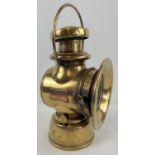 An Edwardian era Joseph Lucas Ltd King of the Road No. 754 oil powered motor car side lamp. Polished