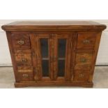 A heavy Indian rubber wood sideboard with 2 central glass panelled doors & 6 small drawers.