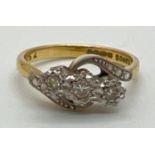 A vintage 18ct gold and diamond trilogy ring in a twist setting. With illusion design twist