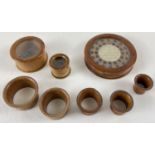 A small collection of vintage treen watchmakers glass topped parts pots and separators. Containers