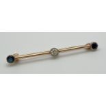 A vintage design 9ct gold bar brooch set with 2 round cut sapphires and a round cut diamond. Each