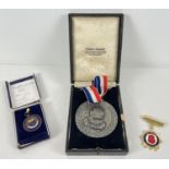 A boxed Regina Academy Of Chefs De Cuisine silver medal and hanging ribbon by Thomas Fattorini,