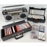 A vintage Prinz STR 1010 stereo radio cassette recorder. Together with 2 vintage cassette cases