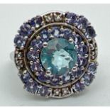 A silver modern design cocktail ring set with iolite and blue & white topaz stones, by The Genuine