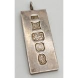 A vintage silver ingot pendant with visible hallmarks to front, hallmarked Birmingham 1977. Total