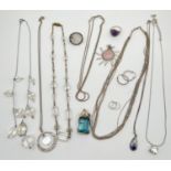 A collection of silver and white metal jewellery items to include necklaces, rings and earrings. Lot