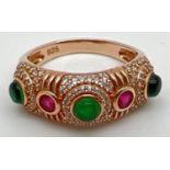 A silver gilt multi-coloured stone half eternity style dress ring. Set with green cabochon stones,