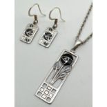 A silver Rennie Mackintosh design floral pendant with matching drop style earrings, by Fish. Black