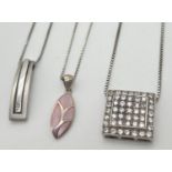 3 silver modern design pendant necklaces. A square shaped pendant set with round clear crystal