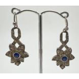 A pair of Art Deco design vintage silver, stone set drop style earrings. Each earring set with a