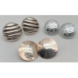 3 pairs of silver and white metal vintage style circular stud earrings, in varying designs. To