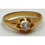 An 18ct gold men's diamond solitaire Gypsy style signet ring. Diamond approx. 0.20ct, gold marks