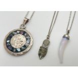 3 vintage and modern design pendant necklaces. A double sided Mexican silver pendant set with