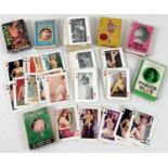 7 assorted vintage packs of adult erotic and pin-up playing cards.