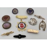 A collection of vintage brooches and badges. To include black enamel mourning brooch with central
