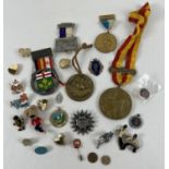 A box of vintage and modern sports medals and pin badges. To include Hockey, Fencing, 2012