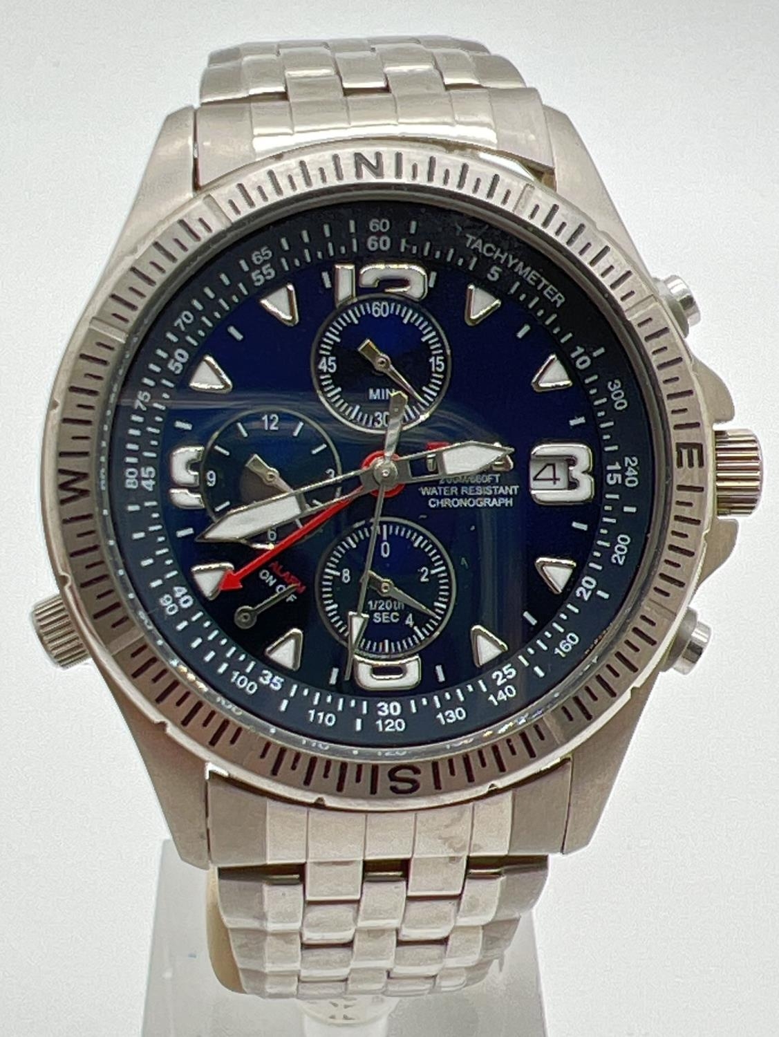 A G-942 chronograph watch by Fila. Stainless steel case and strap with blue face. Luminous hour