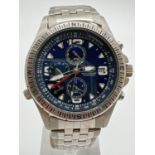 A G-942 chronograph watch by Fila. Stainless steel case and strap with blue face. Luminous hour