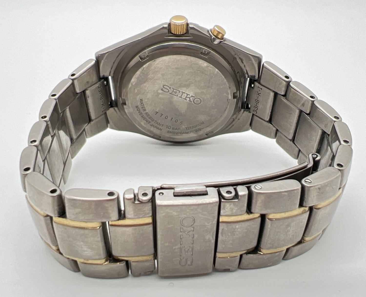 A Seiko 5M62-OAMO kinetic Titanium wristwatch with black face and gold tone hands. Hour markers with - Image 3 of 3