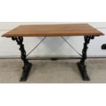 A wooden topped table with cast iron base, obtained from a public house after refurbishment. Painted