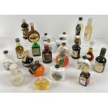 A collection of 26 alcohol miniature bottles to include ceramic Moorland Mead with car, hunting