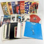 A collection of 34 assorted 1980's vinyl records, all in good condition. 33 x 12" records to