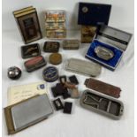 A collection of assorted vintage items to include advertising tins and rolls razors. Lot also