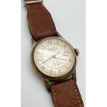 A vintage men's antimagnetic calendar wristwatch by Olivia. Gold tone case with cream face. Gold