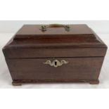 A vintage mahogany tea caddy with 2 interior lidded compartments. Metal swing handle and