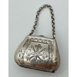 A Victorian silver novelty vinaigrette modelled as a bag/satchel with belcher chain handle. Fully