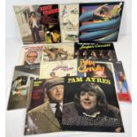 A collection of 12 vintage comedy LP records. To include artists: Billy Connolly, Monty Python,