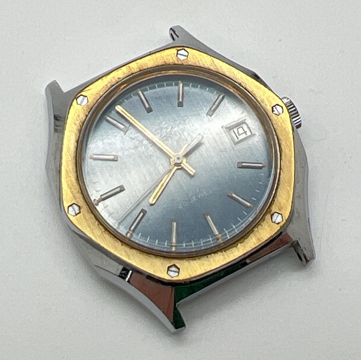 A vintage J.W. Benson men's automatic wristwatch without strap. Hexagon shaped stainless steel